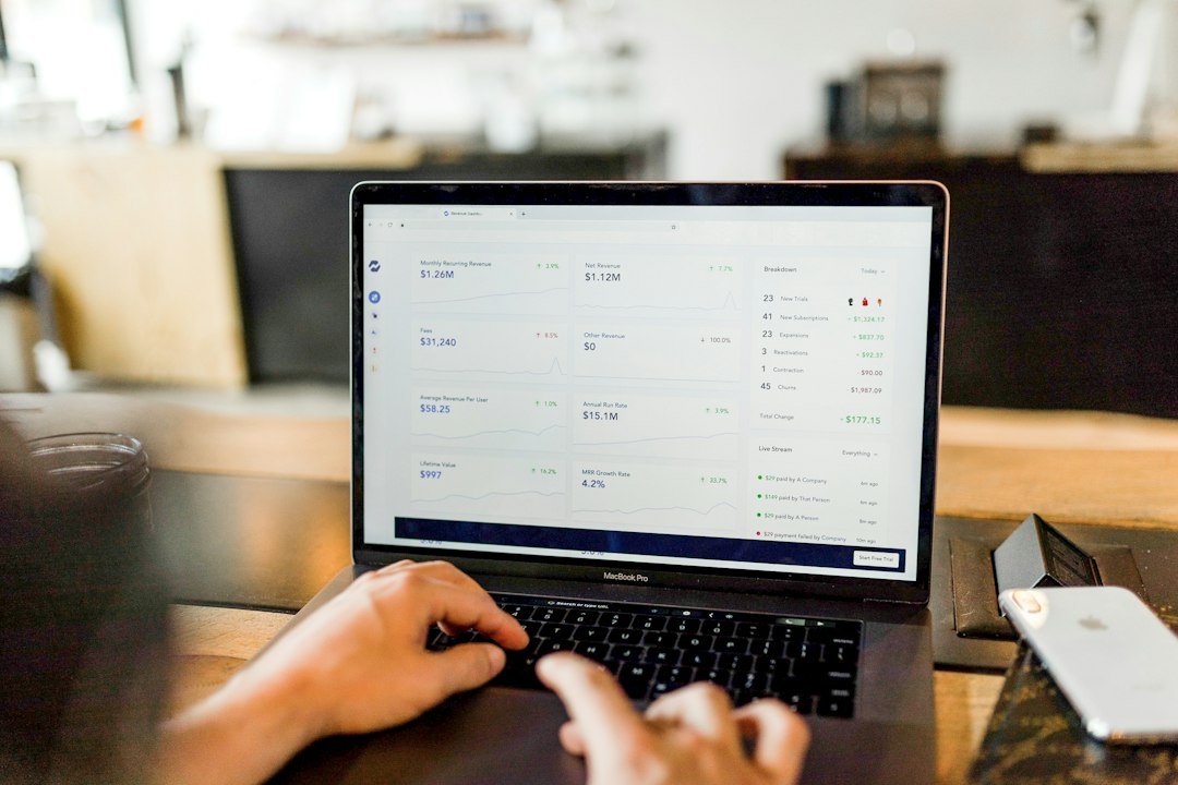 Person reviewing billing and account details on a laptop after canceling Sellvia services